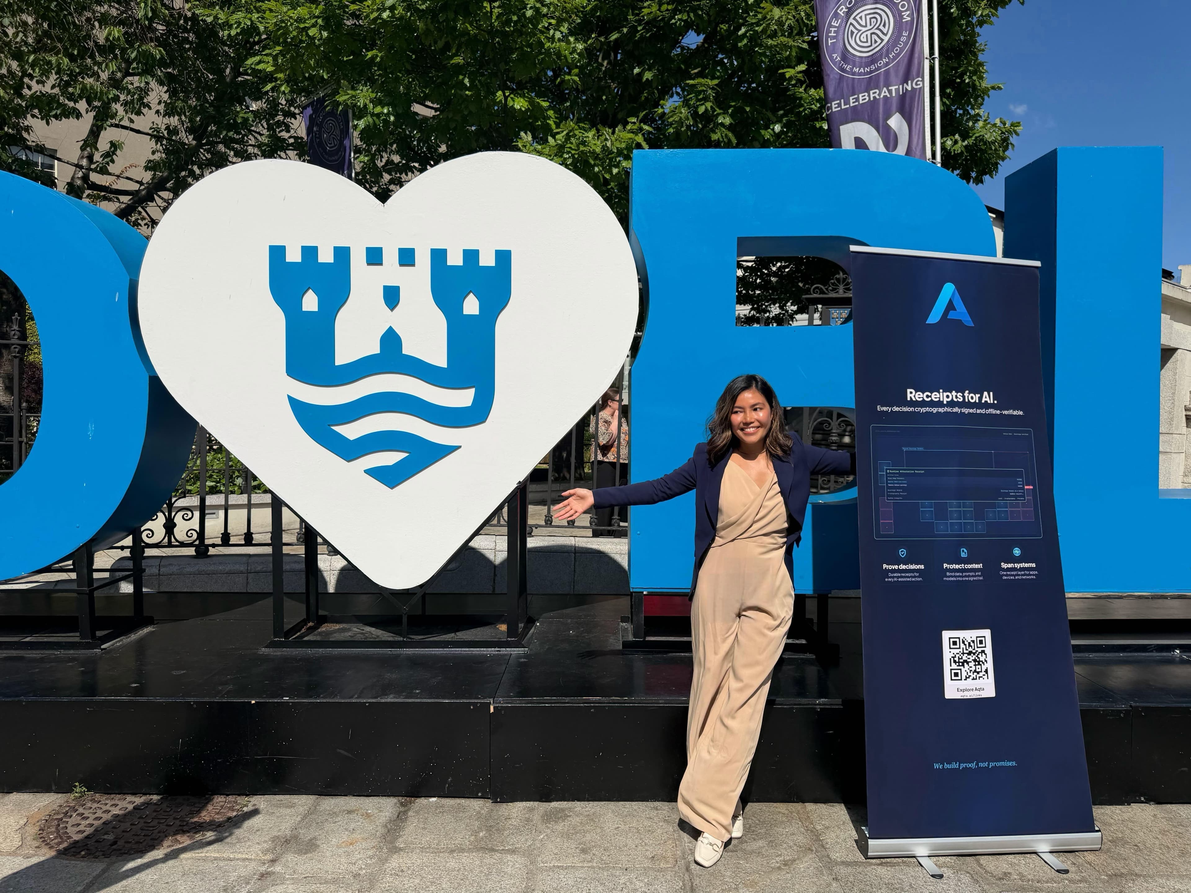 Aqta roll-up banner reading 'Receipts for AI' alongside the I-heart-Dublin sculpture.